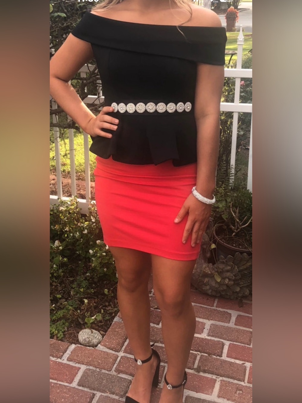 Off-Shoulder Black Top with Coral Mini Skirt — Elegant Two-Piece Look